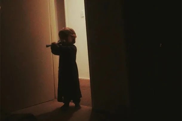 They're listening even when you think they aren't. A toddler enters a dark room after waking up to parents arguing.